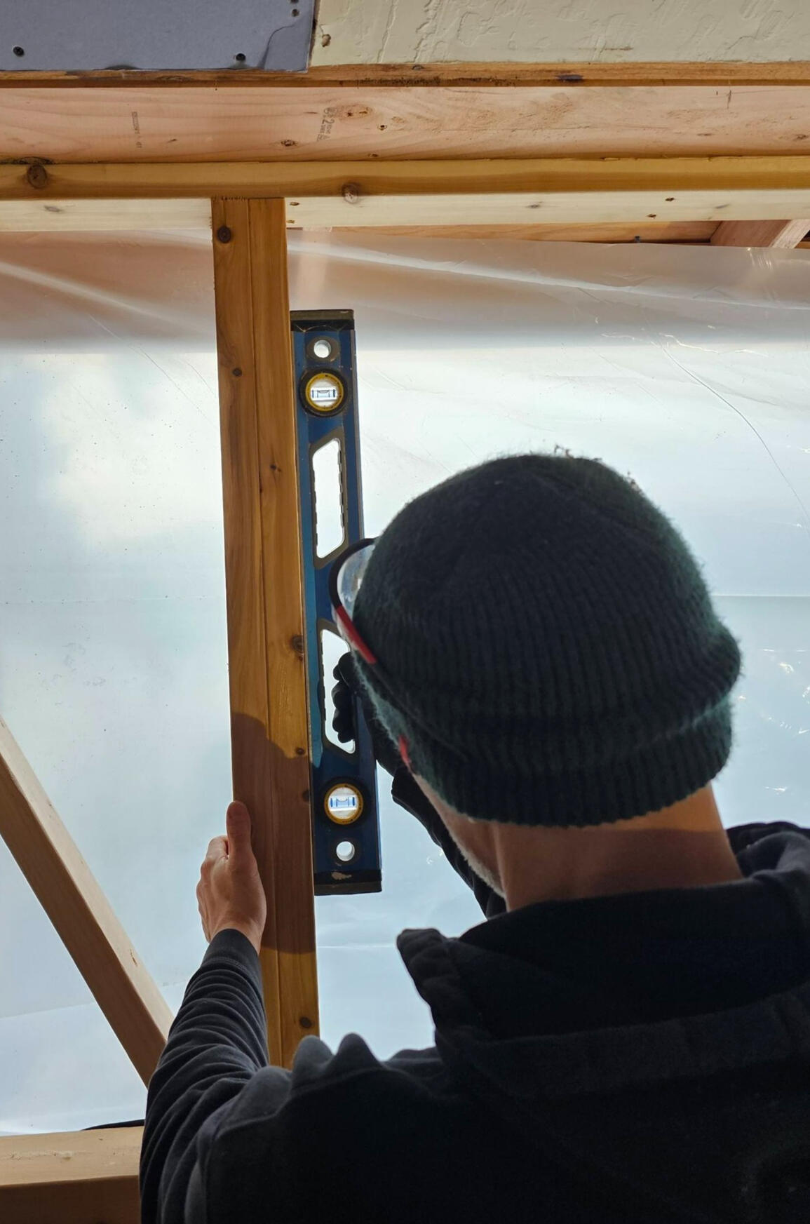 A man working with a level.